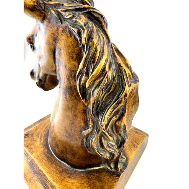 A handsome pair of vintage horse head bookends featuring beautifully sculpted equine profiles with flowing manes and a...