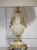 Pair of green onyx table lamps, of urn shape, having gilt metal mounts depicting cherubs on circular stepped bases raised...