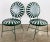 Pair of iconic antique iron sunburst metal garden chairs also referred to as "pinwheel spring" chairs, "Casablanca" or...
