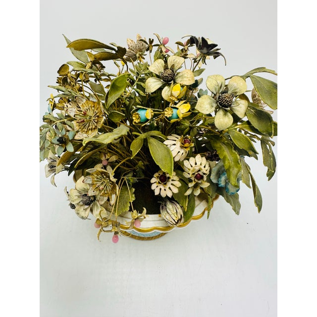 This is a vintage Jane Hutchinson decorative floral arrangement featuring handcrafted metal flowers and leaves in a...