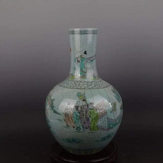 H-43cm,W-28cm This Chinese vintage porcelain vase showcases intricate hand-painted figures and a unique crackle glaze....