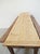 A long, rustic-style table topped with two matching trestle benches. Here's an explanation of what makes this furniture so...