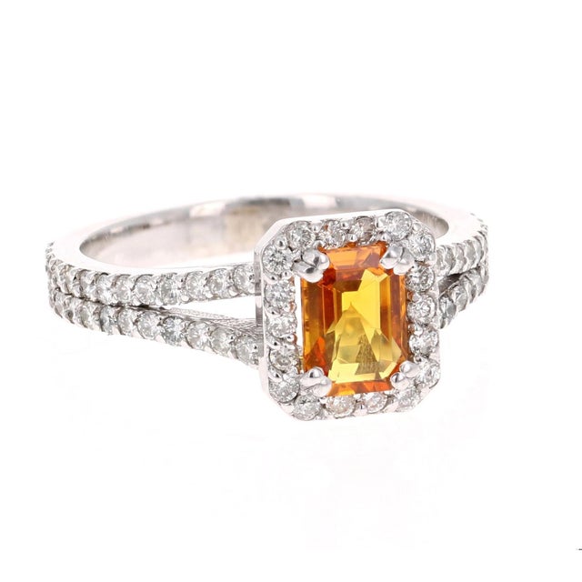 A gorgeous Orange Sapphire and Diamond Ring set in White Gold. It can be the most beautiful and unique Engagement Ring....