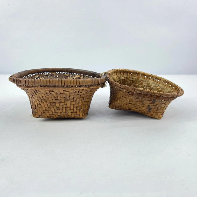 The Kuba handwoven basket/box with a lid, is a testament to the artistry of the Kuba people in the Democratic Republic of...