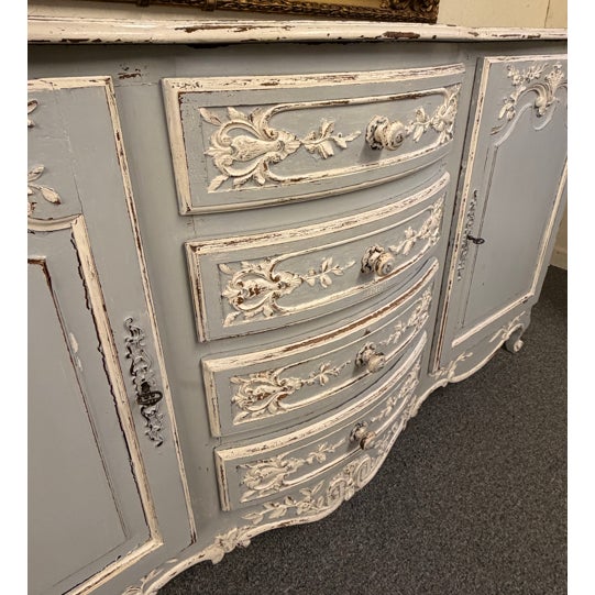 19th century Country French oak buffet sideboard, circa 1870, executed in the Louis XV style with elegant proportions and...