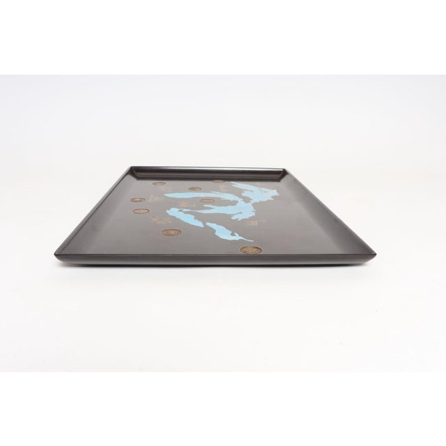 Large, rectangular tray by Couroc of Monterey, California depicting the Great Lakes with representative symbols of each...