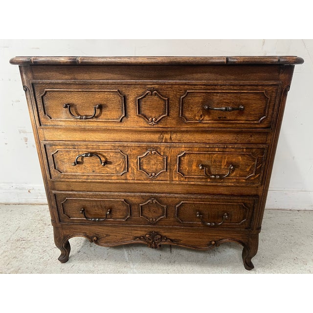 Beautiful louis xv style chest of drawers with panelled sides and scrolled legs chest of drawers with three rows of...