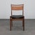 A rare set of four mid-century modern dining chairs crafted in the 1960s, executed in beautifully grained teak and...