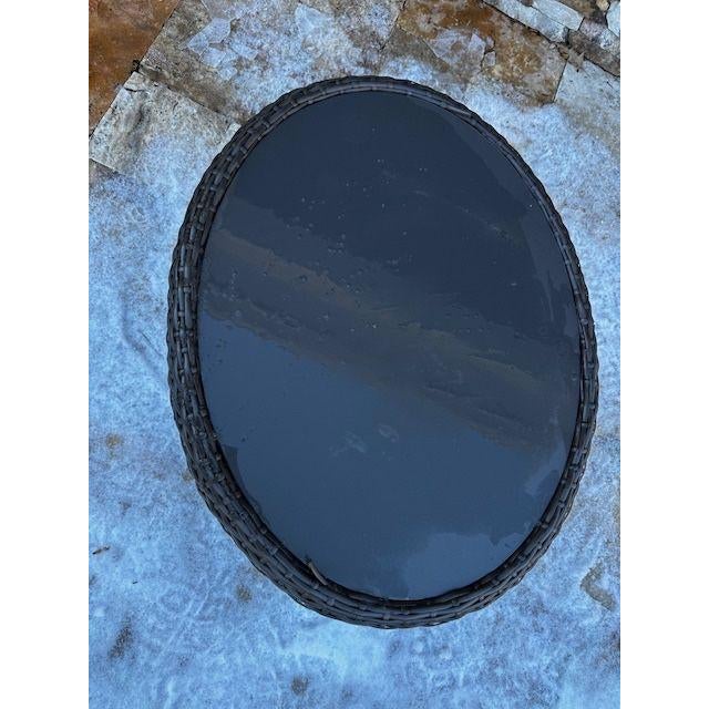 A Gloster wicker outdoor side table featuring a clean, drum-style look woven in durable, all-weather brown resin wicker....