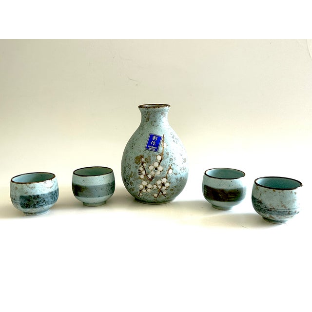 Serve sake in style with this vintage Japanese ceramic decanter and cup set. Made in Japan, the ceramic sake serving set...