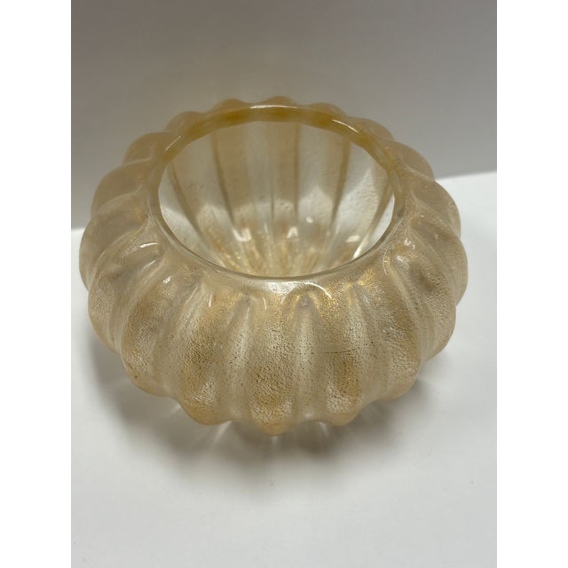 Lovely small bowl with heavy 24k gold powder infused into Murano Glass. Measures 3” tall x 4.5” across. A nice accent piece!