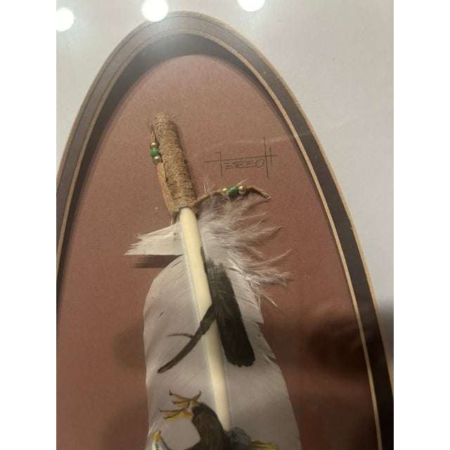 The framed artwork features a hand painted feather depicting a powerfull bald eagle in flight, rendered with fine detail...