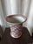 Vintage Andrea by Sadek porcelain vase featuring a pink cross-lattice ribbon design outlined in gold with hand-painted...