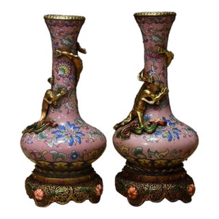 Vintage Chinese Pink Enamel Vase Pair With Dragon Relief and Filigree Stands For Sale