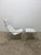 Original saddle-stitched, white leather lounge chair and ottoman on white leather wrapped aluminum frame designed by...