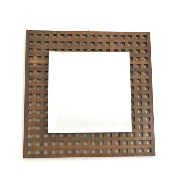 Made in Italy, 1960s. These mirrors feature a square walnut frame. One of them is a little thicker and has a slightly...