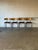 These versatile stacking chairs combine curved wooden backrests with tubular steel frames and cushioned seats. Their sleek...