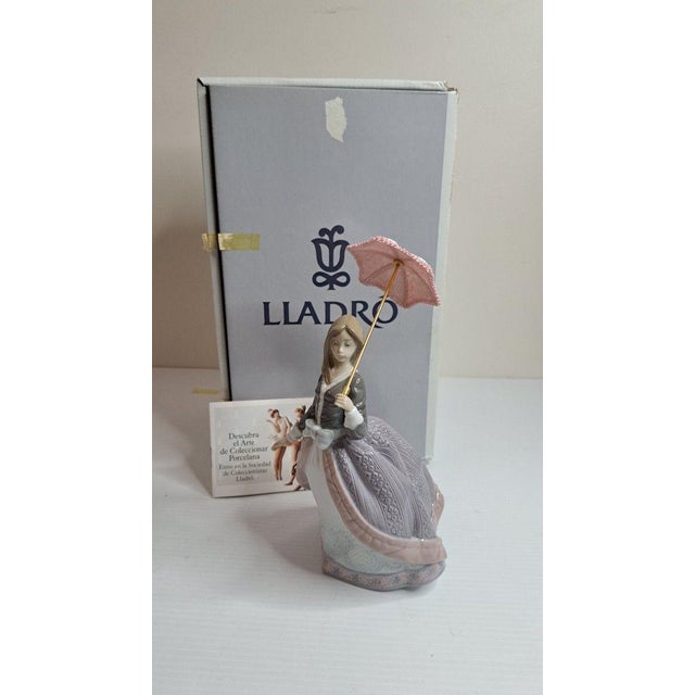 SKU: OT 3254 Lladro 5211 Angela w/Umbrella Porcelain Figurine Retired 1983 Mint w/Box Signed This lovely Lladro figurine...