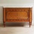 A two-door sideboard in the french louis xvi style, crafted as a high-quality reproduction in solid wood with gilded...