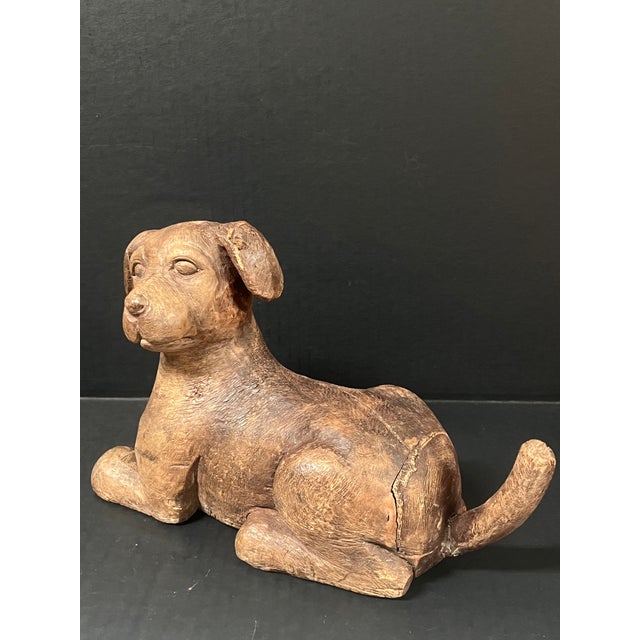 ITEM NAME: Vintage Carved Solid Wood Dog Sculpture ORIGIN: Philippine AGES: Late 20th Century MATERIALS: Wood MEASUREMENT:...