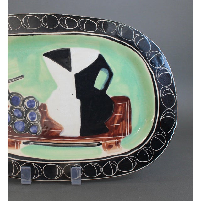 Poët-Laval decorative ceramic platter by Jacques Pouchain (circa 1950s). This rather rare platter incorporates an image of...
