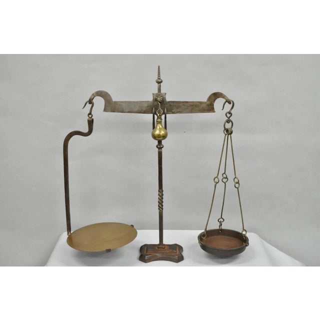Antique English Gothic Arts & Crafts Hand Wrought Iron Balance Beam Scale. Circa Mid 19th Century. Measurements: 31" H x...
