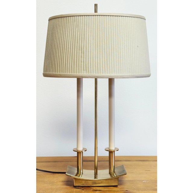 Vintage Stiffel modern brass bouillotte style table lamp. Features a traditional shape with modern lines. Holds two bulbs....