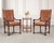 A grand pair of leather and mahogany armchairs or throne chairs crafted in the French Louis XIII, or Baroque taste by...