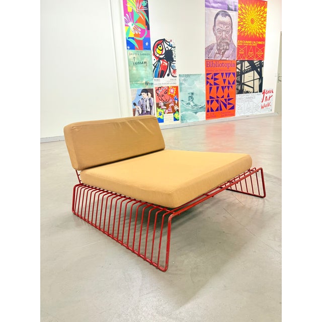 François Arnal (1924-2012) "Texas" model armchair in red lacquered metal, original beige fabric upholstery. Early edition,...