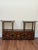 Vintage Asian-inspired pagoda style display cabinet set in dark stained wood with brass mounts and hardware, comprising a...