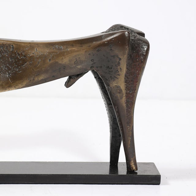 This Mid-Century Modernist bronze deer sculpture, signed by celebrated Israeli artist Aharon Bezalel, is a captivating...