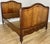 An elegant Antique French double bed crafted in walnut, featuring beautifully shaped head and footboards with warm natural...