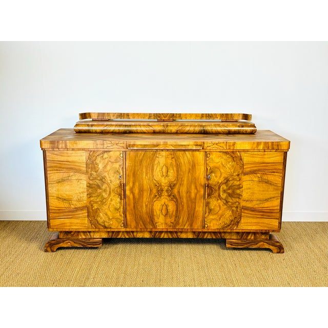 Superb french art deco sideboard dating from the 1930s. this piece is distinguished by its walnut burl veneer, featuring...