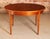 Mid Century round extending teak dining table by Jentique, circa 1960s. Butterfly extension leaf stored underneath....
