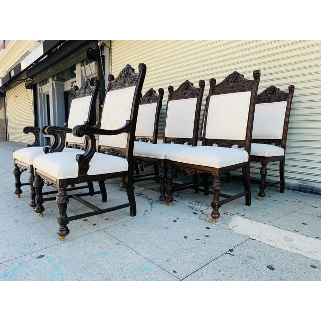 Beautiful set of 10 high back chairs from the early 1900s, the frames are made out of solid wood and heavily carved, the...
