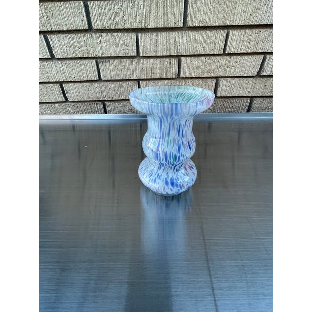 This is a great mid century murano glass vase with great color splash design variation. Vase is medium size and works with...