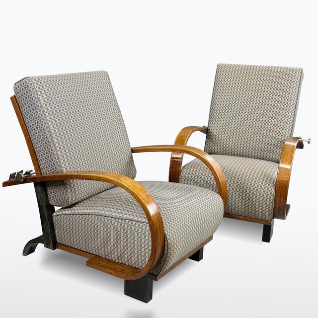 Pair of 1930s Art Deco reclining armchairs with restored oak frames and newly upholstered cushions. Bentwood armrests,...