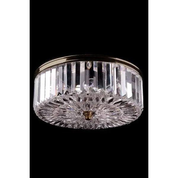 Cut crystal flush mount, 4 inch baguette crystals on outside, patterned crystal on bottom, Cast rim surround on top of...