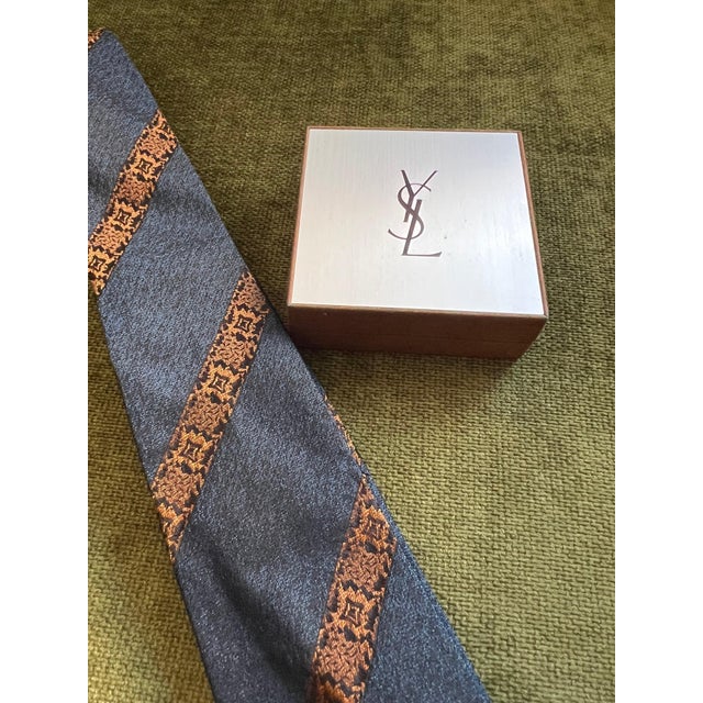 Vintage Yves Saint Laurent YSL Logo Tie Pin In Box gold plate and stainless steel tie pin featuring a front Dior logo, in...
