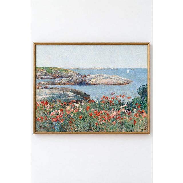 This vintage coastal art print features red and pink poppies overlooking a rocky shoreline and blue ocean, reproduced from...