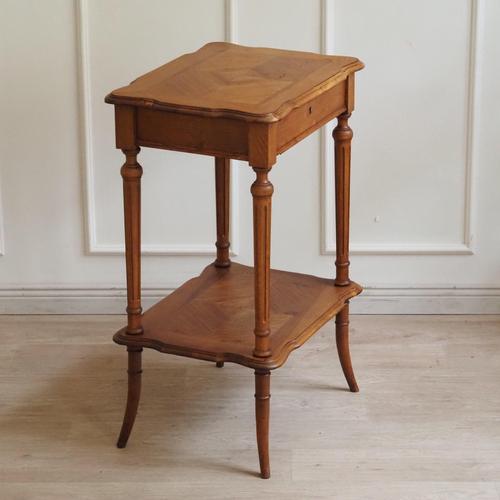 Small antique walnut dressing table with a hinged top and an internal faceted mirror, made around 1910. The slender...