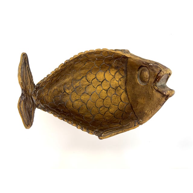 Hand-carved in the form of a whimsical fish, this wood vintage catchall bowl brings character and warmth to any tabletop....