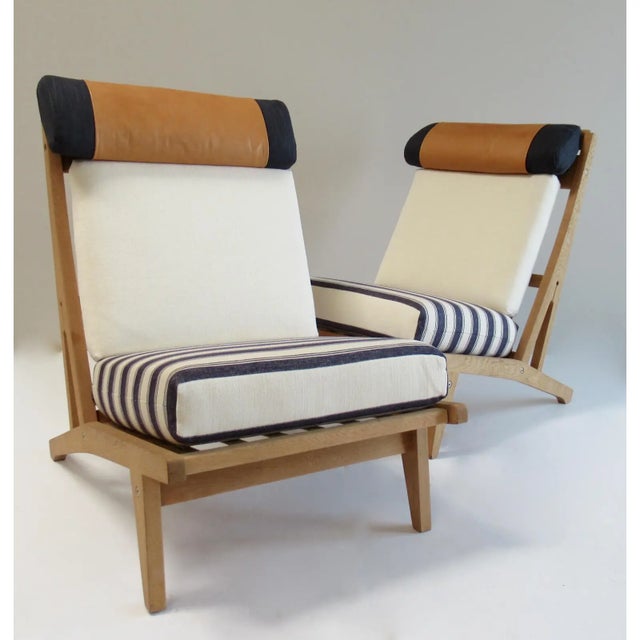 A wonderful and Iconic pair of Teak Wood/Oak circa 1960's, Hans J. Wegner Denmark, "Getama," Lounge Chairs, which, have...