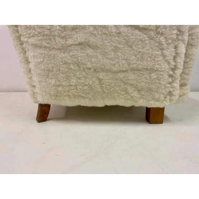 Armchair Newly upholstered in lambswool Deep button and pleated back Generously sized Beech legs Danish 1950s Seat height...