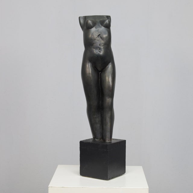 A refined bronze sculpture by dutch artist francine govers, created in the 1990s. The work depicts a standing female...