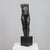 A refined bronze sculpture by dutch artist francine govers, created in the 1990s. The work depicts a standing female...