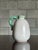 Small off white vase with a green handle from Sweden circa 1940s. Really nice form and glaze.