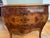 A gorgeous serpentine-front bombé commode in beautifully figured burl walnut. Three deep drawers glide smoothly, dressed...