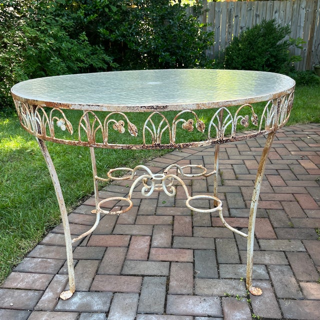 Bring a touch of New Orleans charm to your patio with this rare mid-century dining set. This classic Parisian style set...