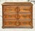 An exceptional vintage English Georgian-style chest of drawers, masterfully crafted with richly figured hardwood and...